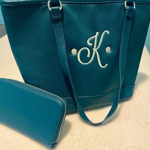 Dark green shoulder bag with matching wallet. Brand new , never been used.